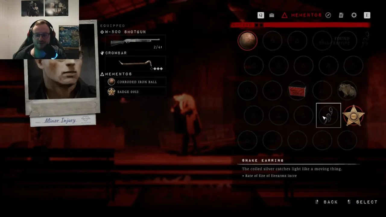 The Mementos menu with the Snake Earring selected